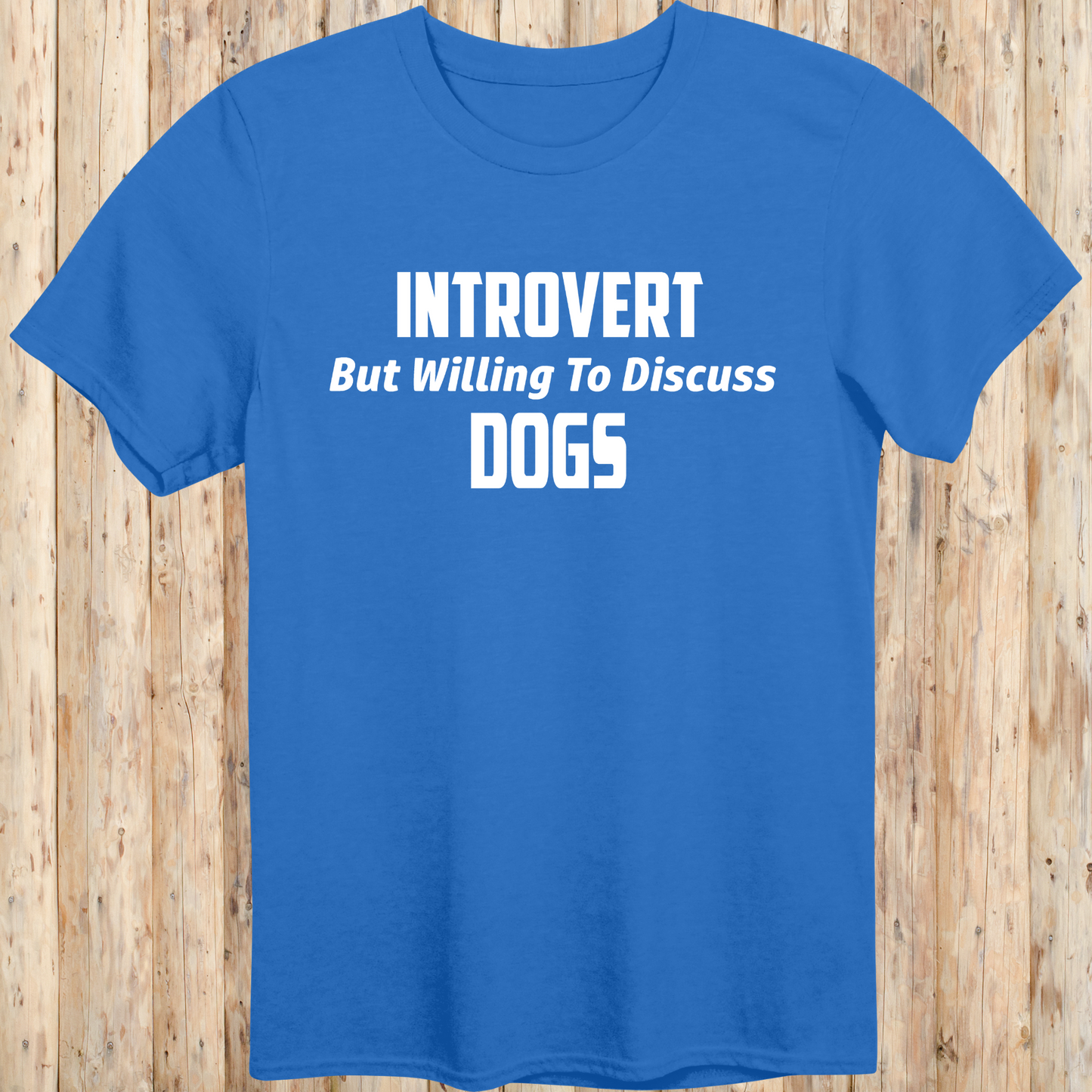 royal blue unisex t-shirt with white text that reads 'Introvert But Willing to Discuss Dogs', 
