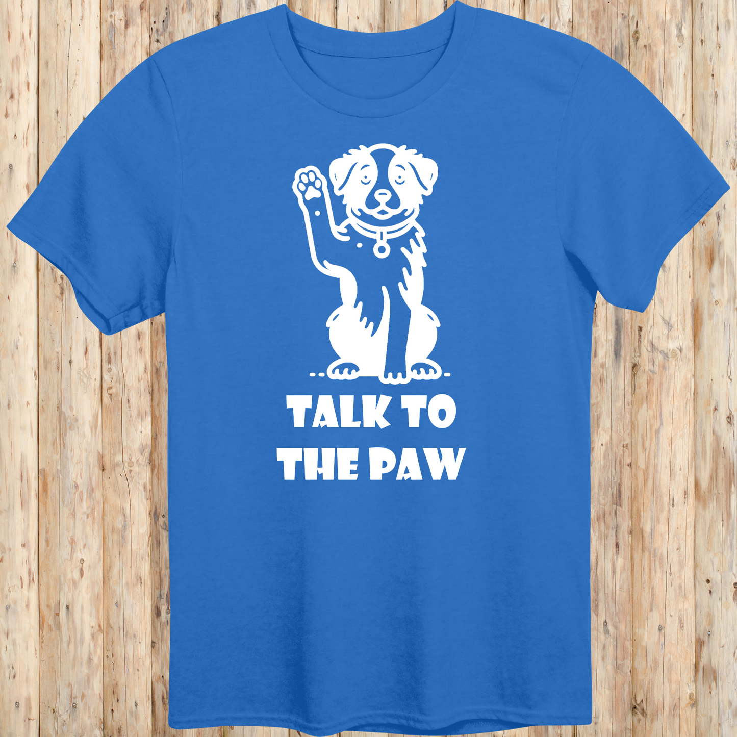 Royal blue unisex t-shirt with text that says 'Talk to the Paw', ideal for dog lovers and pet parents with a fun, sassy style