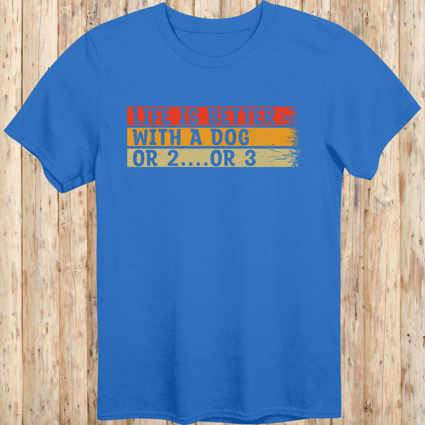 Royal blue unisex t-shirt with text that reads 'Life Is Better With a Dog… or 2 or 3', perfect for multi-dog owners and pet lovers