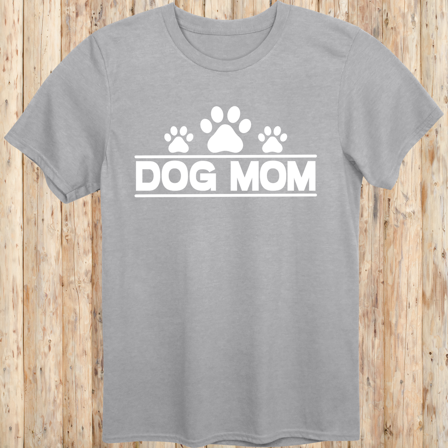 Sport grey unisex t-shirt with bold text that reads 'Dog Mom', ideal for pet parents, dog lovers, and animal rescue supporters