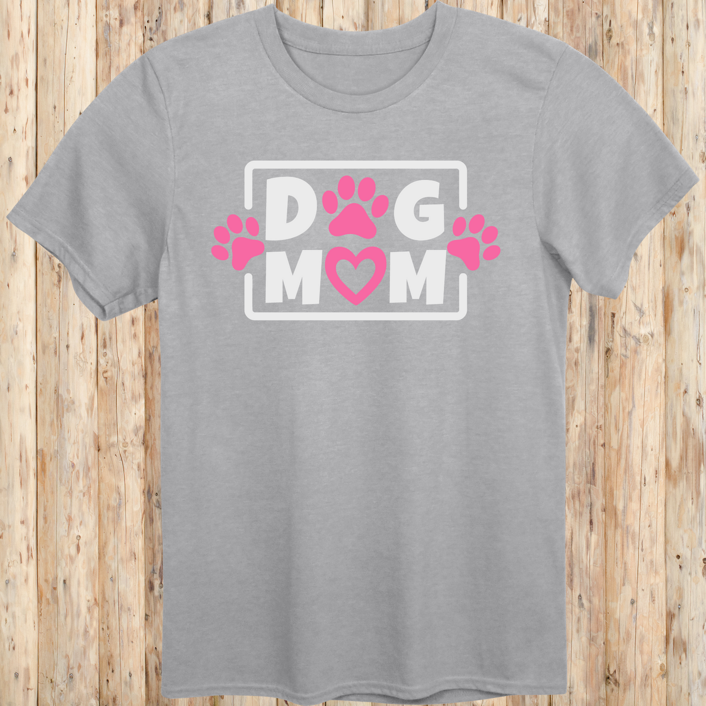 Sport grey unisex t-shirt with bold text that says 'Dog Mom', ideal for pet moms, dog lovers, and rescue advocates
