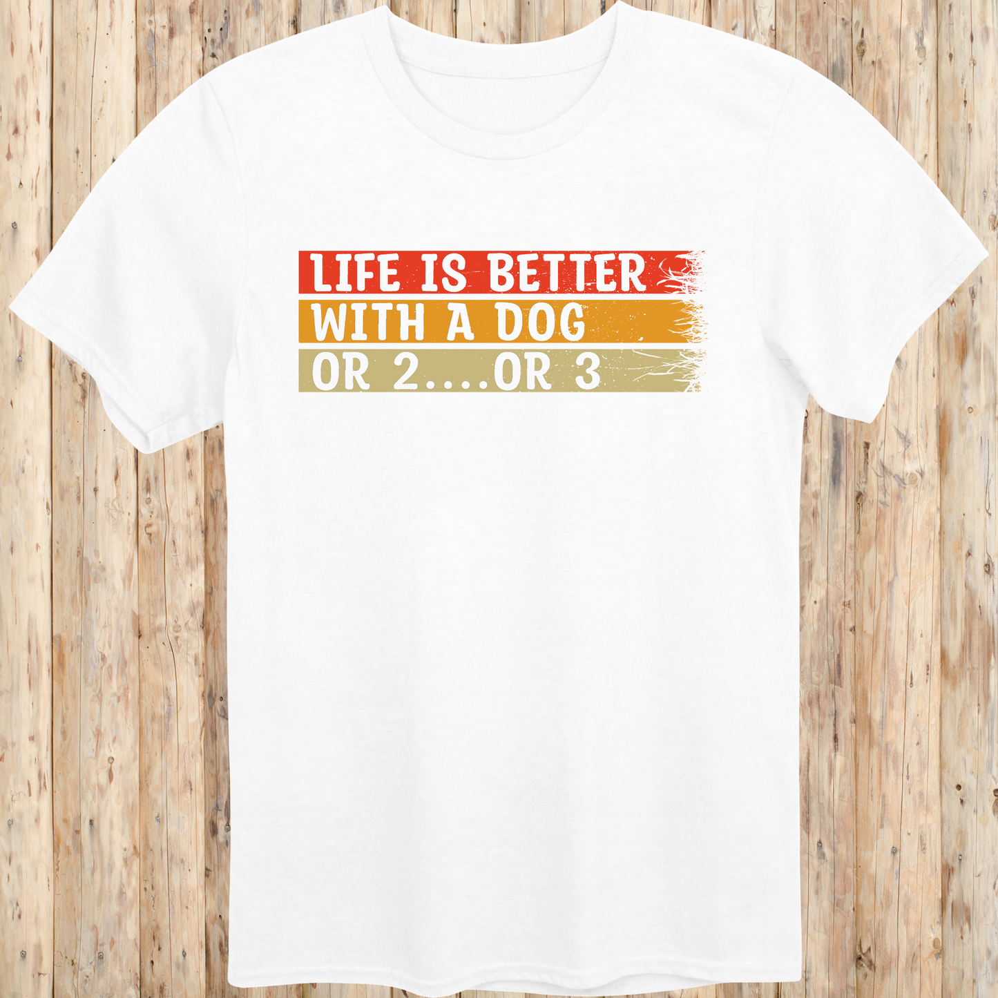 White unisex t-shirt with text that reads 'Life Is Better With a Dog… or 2 or 3', perfect for multi-dog owners and pet lovers