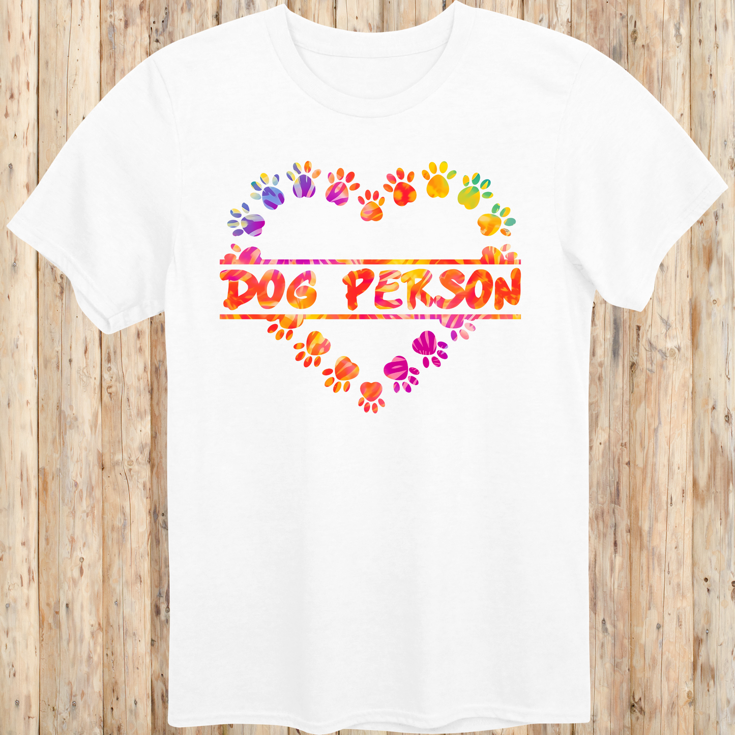 White unisex t-shirt with the words 'Dog Person' and a colorful heart-shaped paw print design, perfect for dog lovers and pet parents