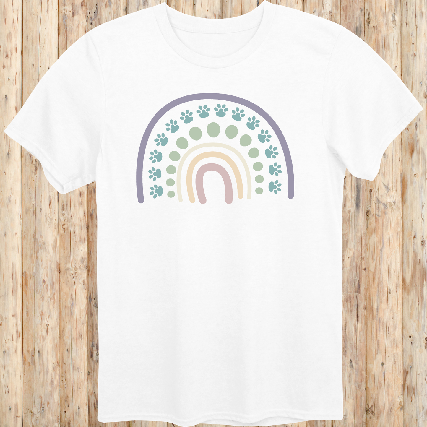 White unisex t-shirt with a colorful boho rainbow and white dog paw print design, ideal for dog lovers and pet parents with a boho style