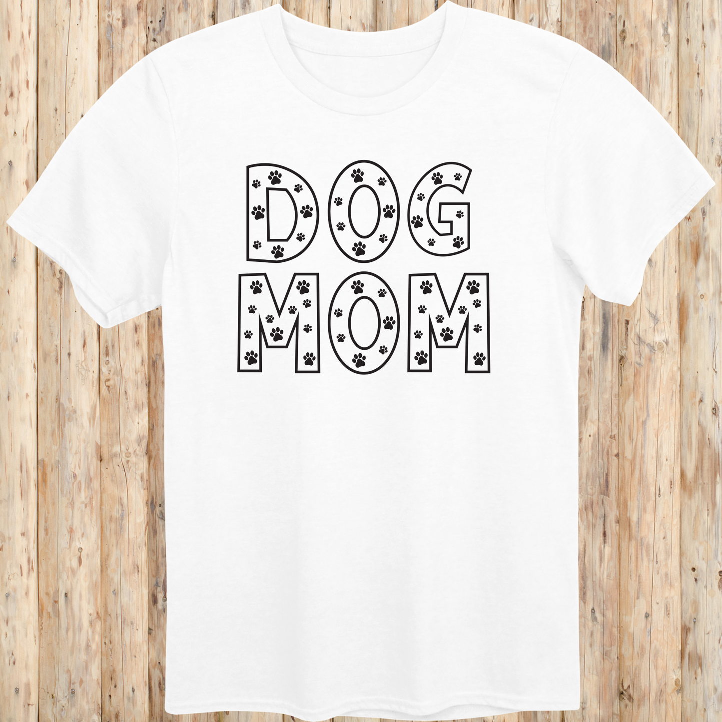 White unisex t-shirt with the words 'Dog Mom' in white text and small paw print accents, ideal for pet moms and dog lovers