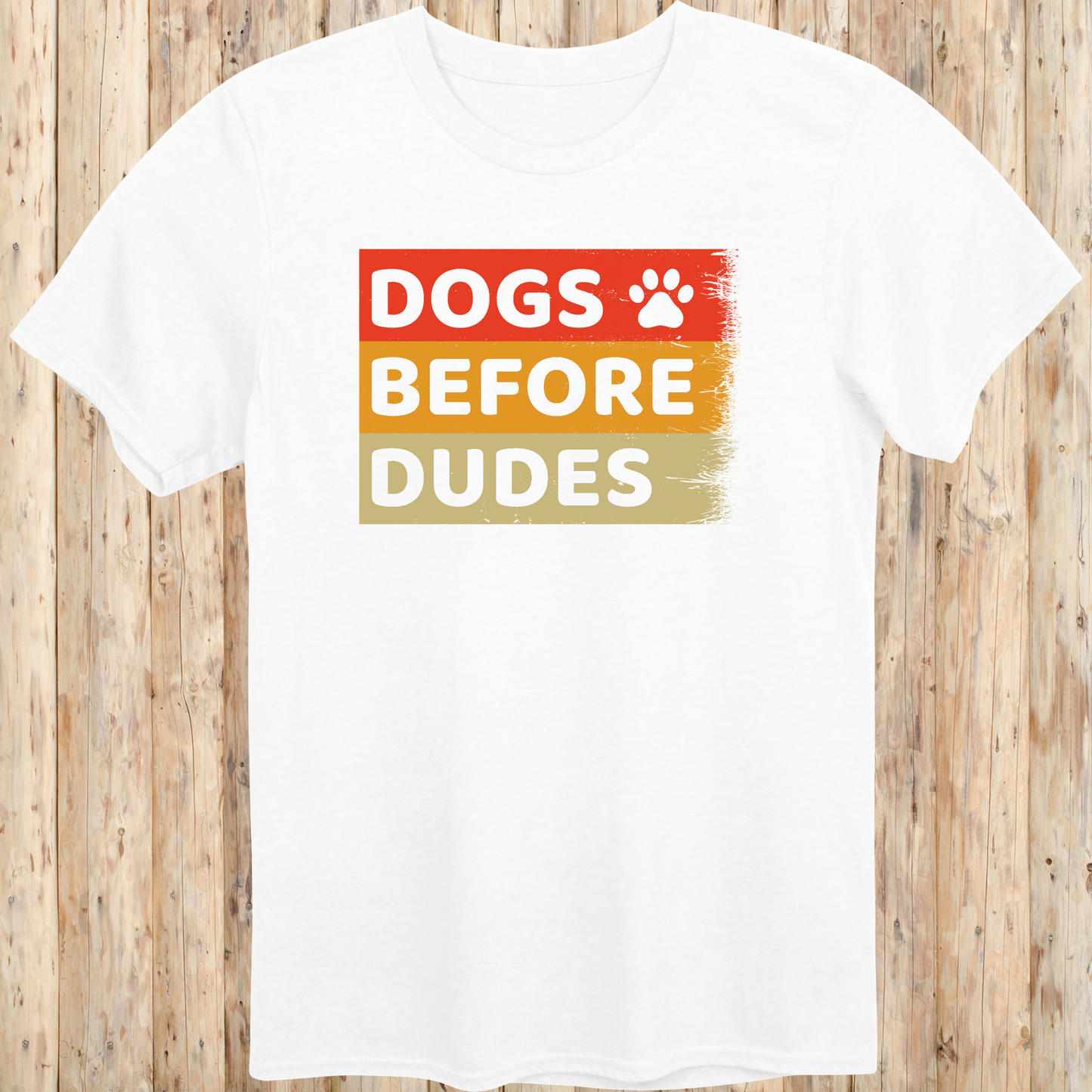 White unisex t-shirt with text that says 'Dogs Before Dudes', perfect for dog moms and dog-loving women with a sense of humor